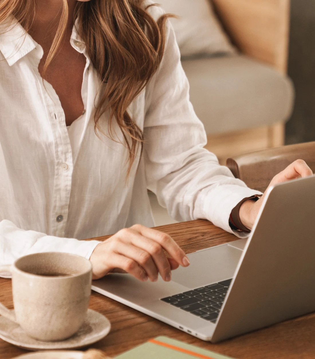 Woman exploring her next home on a laptop