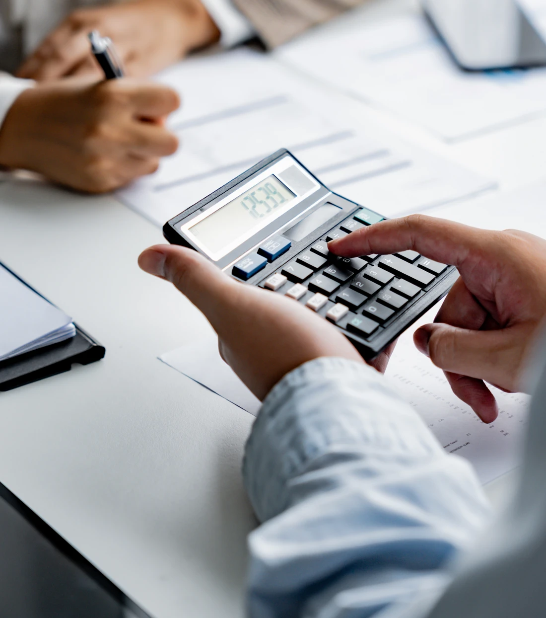 Homebuyers reviewing financial details with an advisor